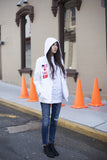 Candid shot of Four Flag Worldwide Hooded Windbreaker Coach Jacket in White on model