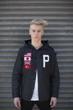 Partially buttoned Four Flag Worldwide Hooded Windbreaker Coach Jacket in Black on model