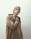 Candid shot of Elongated Hooded Pullover Trench in Khaki on model