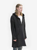 Side angle view of Elongated Hooded Pullover Trench in Black on model