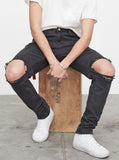 Washed faded black destroyed distressed denim jeans by profound aesthetic