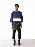 Full body shot of Color Blocked Elongated Split-Seam Windbreaker Nylon Pullover in Navy/White/Black on model paired with black slacks