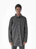 Front view of model wearing Elongated Button Down Canvas Shirt in Black