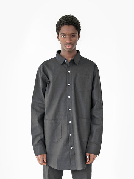 Front view of model wearing Elongated Button Down Canvas Shirt in Black