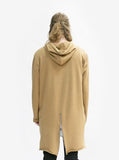 Back view of Elongated Hooded Pullover Trench in Khaki on model, featuring fishtail detail