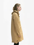 Right side view of Elongated Hooded Pullover Trench in Khaki on model