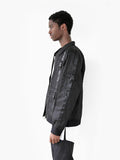 Left side shot of Lone Sentry Strap Jacket in Black on model