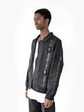 Side angle view of Lone Sentry Strap Jacket in Black on model