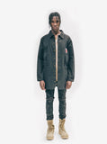 Head to toe shot of model wearing Elongated Cold War Work Jacket in Black with black denims and work boots