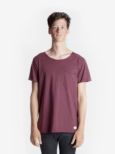 Front view of Basic Raw-Cut Elongated Short Sleeve Tee in Oxblood on model