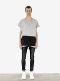 Head to toe front view of Cut-Off Color Blocked Kangaroo Sweatshirt Tee in Gray/Black on model with black denim and Basic Raw-Cut Elongated Short Sleeve Tee in Off-White