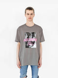 Front view of Absent Tee in Faded Khaki Gravel on model