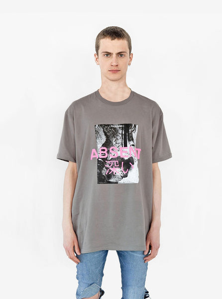 Front view of Absent Tee in Faded Khaki Gravel on model