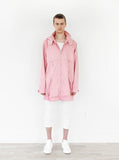 Head to toe shot of Rose Collins Box Jacket in Light Pink on model paired with white denim