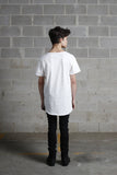 Back view of Basic Raw-Cut Elongated Short Sleeve Tee in Off-White on model