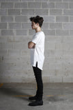 Left side view of Basic Raw-Cut Elongated Short Sleeve Tee in Off-White on model