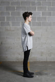 Right side angle of Basic Raw-Cut Elongated Short Sleeve Tee in Heather Gray on model