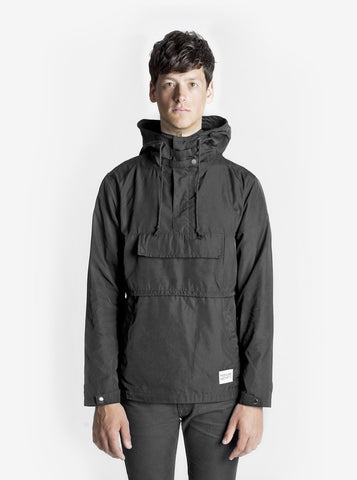 Front image of Torpedo Pocket Anorak Pullover Windbreaker Jacket in Midnight Black on model