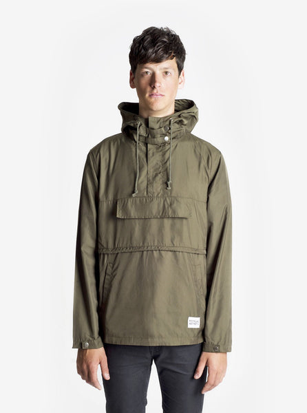 Front view of Torpedo Pocket Anorak Pullover Windbreaker Jacket in Olive on model