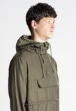 Side angle view of Torpedo Pocket Anorak Pullover Windbreaker Jacket in Olive on model