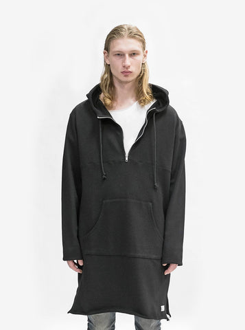 Front image of Elongated Hooded Pullover Trench in Black on model