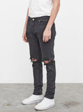 Washed faded black destroyed distressed denim jeans by profound aesthetic