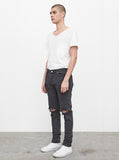 Washed faded black destroyed distressed denim jeans by profound aesthetic