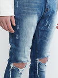 Medium Blue wash blue destroyed distressed denim jeans by profound aesthetic