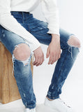 Medium Blue wash blue destroyed distressed denim jeans by profound aesthetic