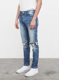 Medium Blue wash blue destroyed distressed denim jeans by profound aesthetic