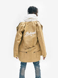 Candid back shot of Elongated Cold War Work Jacket in Camel 