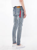 Medium Blue washed distressed paint splatter denim destroyed skinny fit jeans by profound aesthetic