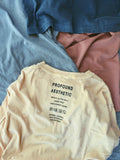 Layers of Pigment Dyed Basic Tee in Burnt Banana, Washed Rust, Faded Black, and Sandstone