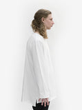 Side view of Basic Elongated Long-Sleeve Crewneck Tee in White on model