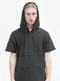 Close up front detail of Reversed French Terry Pullover Raw-Cut Hoodie in Black on model