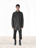 Head to toe front shot of Elongated Button Down Canvas Shirt in Black on model