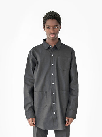 Front view of model wearing Elongated Button Down Canvas Shirt in Black 