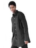 Candid shot of Elongated Button Down Canvas Shirt in Black on model