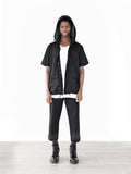 Full shot of Half-Sleeve Detachable Hooded Coach Jacket Windbreaker in Black with hood up on model