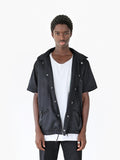 Front view of Half-Sleeve Detachable Hooded Coach Jacket Windbreaker in Black on model