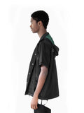 Left view of Half-Sleeve Detachable Hooded Coach Jacket Windbreaker in Black on model