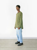 Head to toe look of Basic Elongated Long-Sleeve Crewneck Tee in Olive on model paired with light blue denim