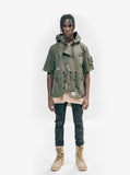 Head to toe shot of Short-Sleeve Asymmetrical Hooded Parka in Olive on model