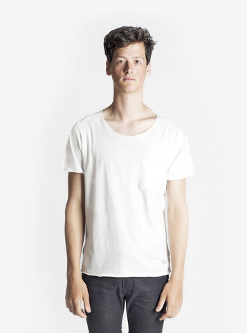 Front view of Basic Raw-Cut Elongated Short Sleeve Tee in Off-White on model