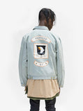 Back view of Sand-Blast Light-Wash Denim Jacket. Eagle crest and logo banner screen print.