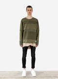 Full body front shot of Half Reversed Terry Panel Pullover in Olive on model, layered with Basic Raw-Cut Elongated Short Sleeve Tee in Sand and black denim