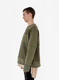 Left side view of Half Reversed Terry Panel Pullover in Olive on model