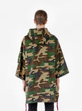 Back view of Kengi Cotton Poncho in Woodland Camo on model