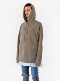 Side angle view of Pigment Dyed Washed Hoodie in Faded Khaki on model, paired with Basic Raw-Cut Elongated Short Sleeve Shirt in Off-White and ripped denim