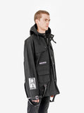 Side angle view of Cargo Belt Graphic Jacket in Black on model